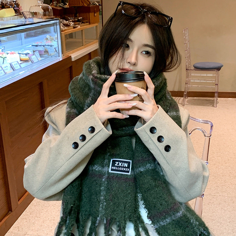 model wearing oversized beige flannel scarf winter fashion accessory