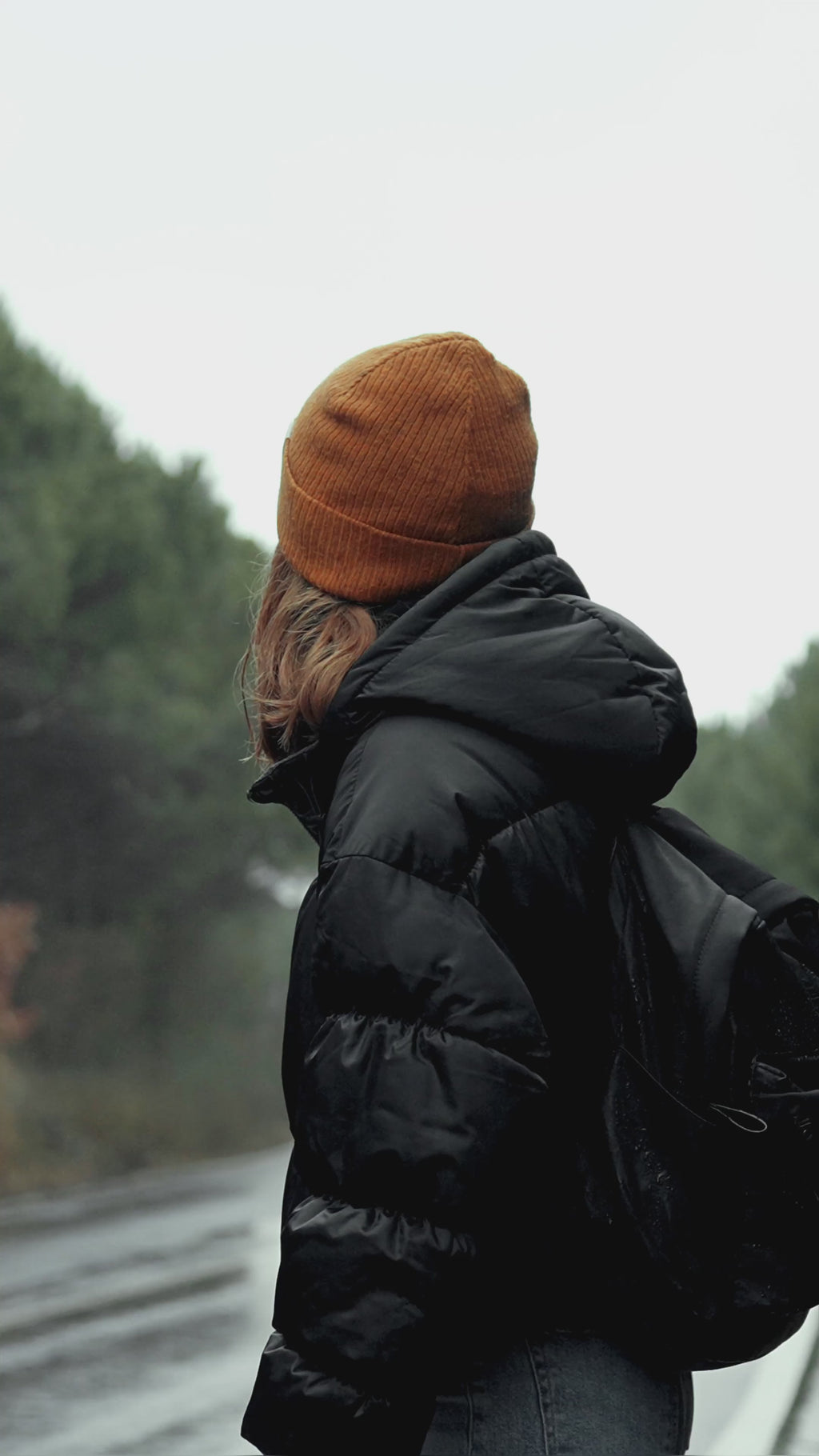 Woman wearing warm and cozy winter puffer jacket.