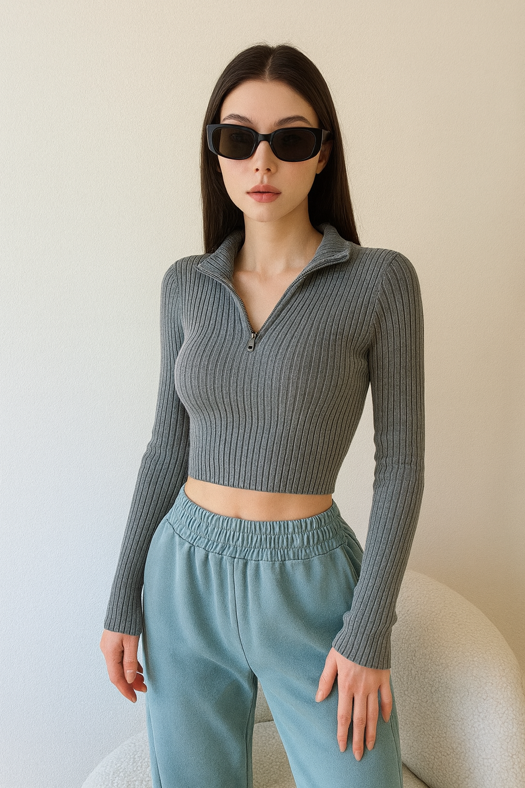 woman wearing a dark gray ribbed quarter zip top