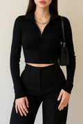 black slim fit ribbed top modeled indoors