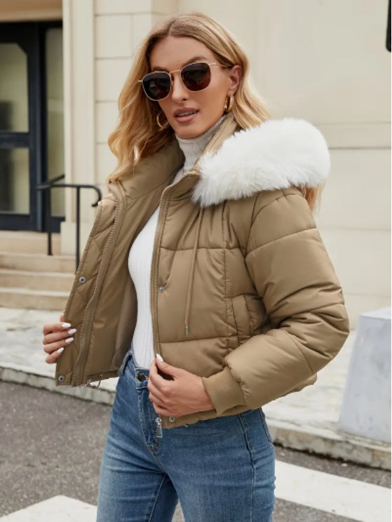 Khaki faux-fur hooded jacket styled with jeans for a winter outfit.